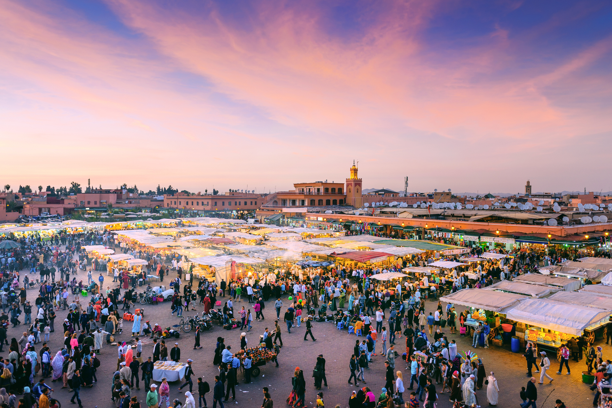 Famous Djemaa El Fna Square in early evening light, Marrakech, Morocco with the Koutoubia Mosque, Northern Africa.Nikon D3x